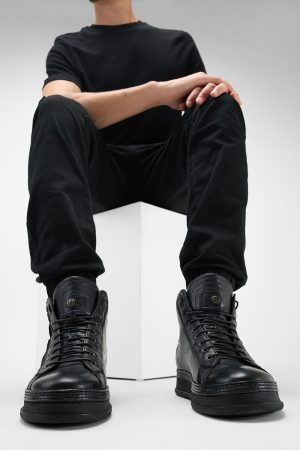 Men-wearing-COLE-black-welted-distressed-high-leather-sneakers-245035.jpg
