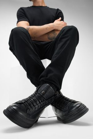Men-wearing-COLE-black-welted-distressed-high-leather-sneakers-245039.jpg