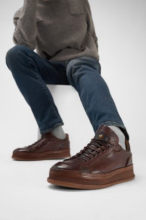 Men-wearing-COLE-cognac-welted-distressed-leather-sneakers-242302.jpg