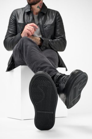 Men-wearing-COLE-rugged-black-welted-distressed-leather-sneakers-24854.jpg
