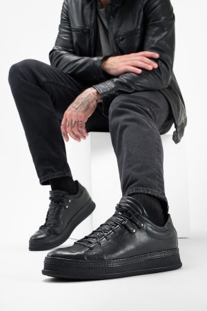 Men-wearing-COLE-rugged-black-welted-distressed-leather-sneakers-24880.jpg